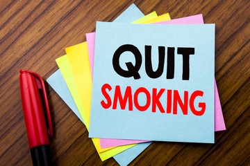 Handwriting Announcement text Quit Smoking.  Concept for Stop for Cigarette  Written on sticky...