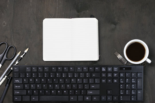 Workplace with keyboard, coffee and stationery