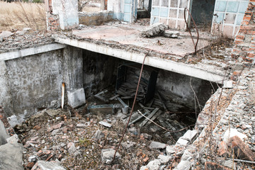 Old destroyed an abandoned multi-storey building in a military town