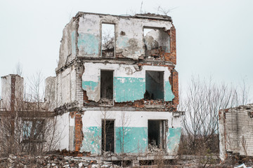 Old destroyed an abandoned multi-storey building in a military town