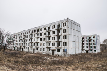 Old destroyed an abandoned multi-storey building in a military town