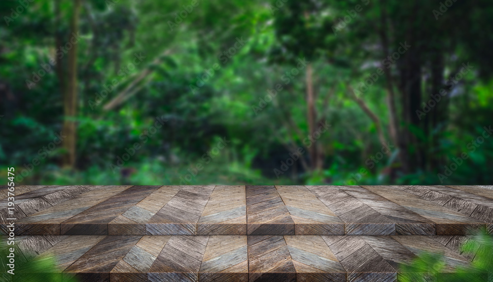 Aufkleber Empty step grunge wood table top with blur tree in tropical forest with bokeh light at background,Mock up template for display of your design,Banner for advertise of product,panorama view
