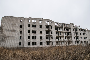 Old destroyed an abandoned multi-storey building in a military town