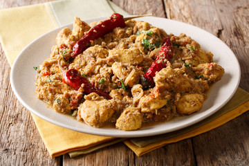 Homemade chicken curry with a dry chili closeup on a plate. horizontal