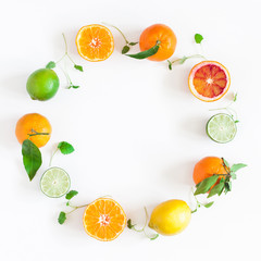 Fruit background. Colorful fresh fruits on white table. Orange, tangerine, lime, lemon, grapefruit. Flat lay, top view, copy space, square