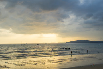 KRABI THAILAND - 2 FEB 2018: People relax and walking at Ao Nang beach before the sunset, Ao Nang beach is a famous tourist destination in Krabi, Thailand