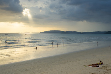 KRABI THAILAND - 2 FEB 2018: People relax and walking at Ao Nang beach before the sunset, Ao Nang beach is a famous tourist destination in Krabi, Thailand