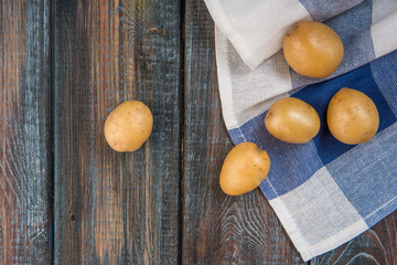 Baby potatoes on a table. Raw potatoes