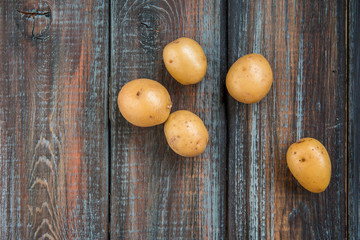 Baby potatoes on a table. Raw potatoes