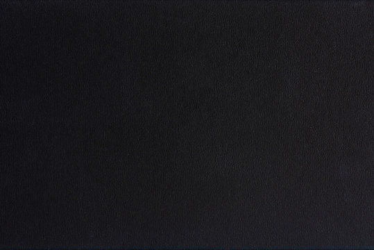 Textured blank black paper background