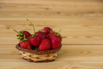 Strawberries in a little basket. Fresh strawberry