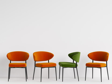 A green chair among orange chairs on white backgrond. Concept of minimalism. 3d rendering mock up
