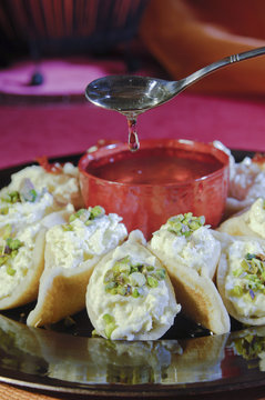 Pouring Syrup on Asafeer, Arabic Sweets for Ramadan and Eid