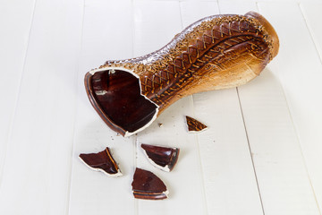 brown broken vase on white background vase fall down broken on white background