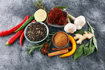 Spices and herbs on grey background. Food and cuisine ingredients.