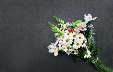 Fresh spring bouquet of flowers on wooden background. Selective focus. Place for text..