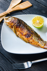 Fried fish served on the plate