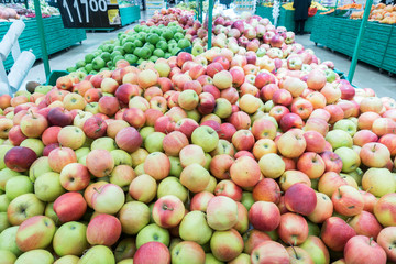 Red and green apples at the farmers market. red and green apples on the market
