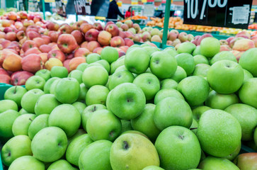 Red and green apples at the farmers market. red and green apples on the market