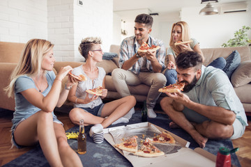 Group of friends eating pizza snack at home