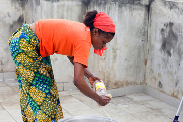 young woman washes dishes