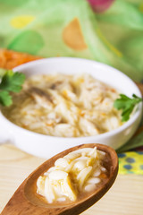 noodle soup and chicken with carrot and garlic