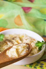 noodle soup and chicken with carrot and garlic