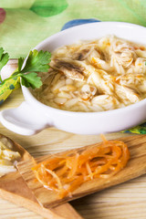 noodle soup and chicken with carrot and garlic