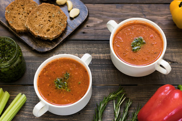 Thick Italian soup minestrone on a wooden table
