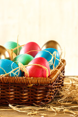 Happy Easter. Basket with Easter eggs on white background. Place for Text.