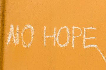 No hope handwriting with chalk on orange metal background