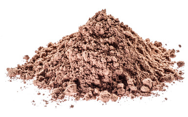 Cocоa powder or carob powder on white background.