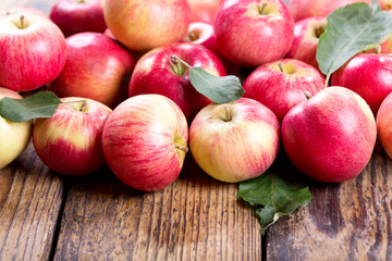 fresh red apples with leaves