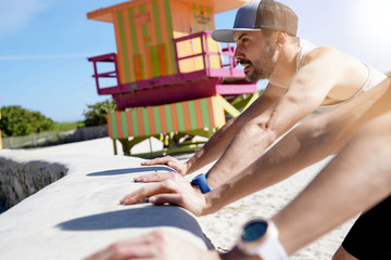 Fitness people stretching out in Miami Beach