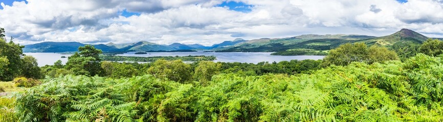Fototapeta na wymiar Loch Lomond wide panorama, Scotland. Loch Lomond is a common day trip from Glasgow
