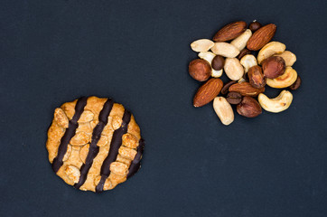 The cookie is made with chocolate and a variety of nuts.