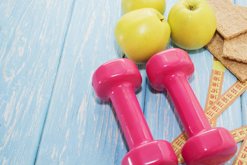The concept of a healthy diet. Small dumbbells. healthy lifestyle. sport. Fitness food.