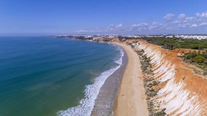 Fototapeta na wymiar Aerial rocks and cliffs seascape shore view of famous Falesia beach, Algarve.