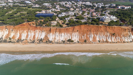 Aerial rocks and cliffs seascape shore view of famous Falesia beach, Algarve.