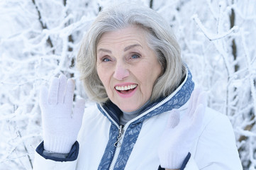 mature woman in winter posing outdoors