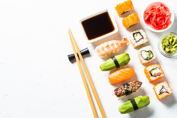 Sushi and sushi roll set on white background. © nadianb