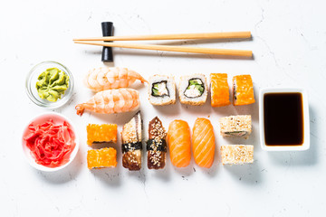 Sushi and sushi roll set on white background. © nadianb