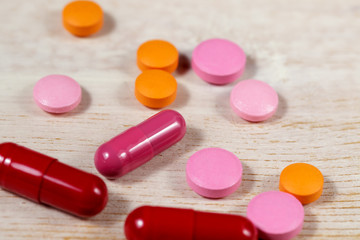 Red capsules and colorful pills