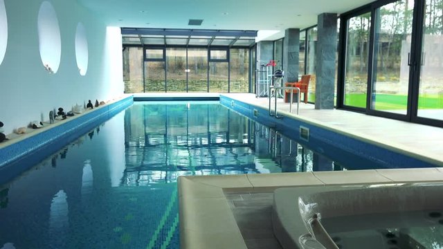 An indoor swimming pool and bath in a luxurious house