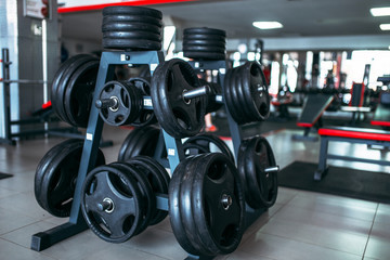 Fototapeta premium Weights for a bar, sport equipment in gym
