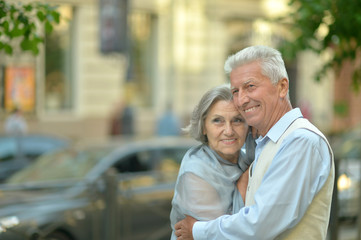 senior couple on city street