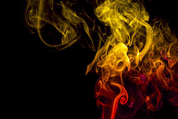 Colored smoke on black background