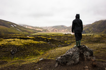 Female Hiker Standing On Rock While Enjoying Nature At Iceland