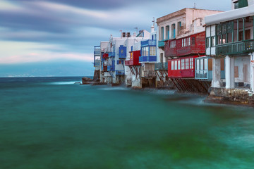 Famous view, Mikri Venetia or Little Venice during morning blue hour on the island Mykonos, The island of the winds, Greece