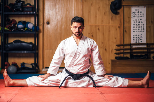 Martial arts master doing stretching exercise